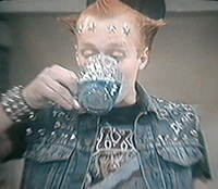 Vyvyan drinks poison, for nobody dies in the young ones